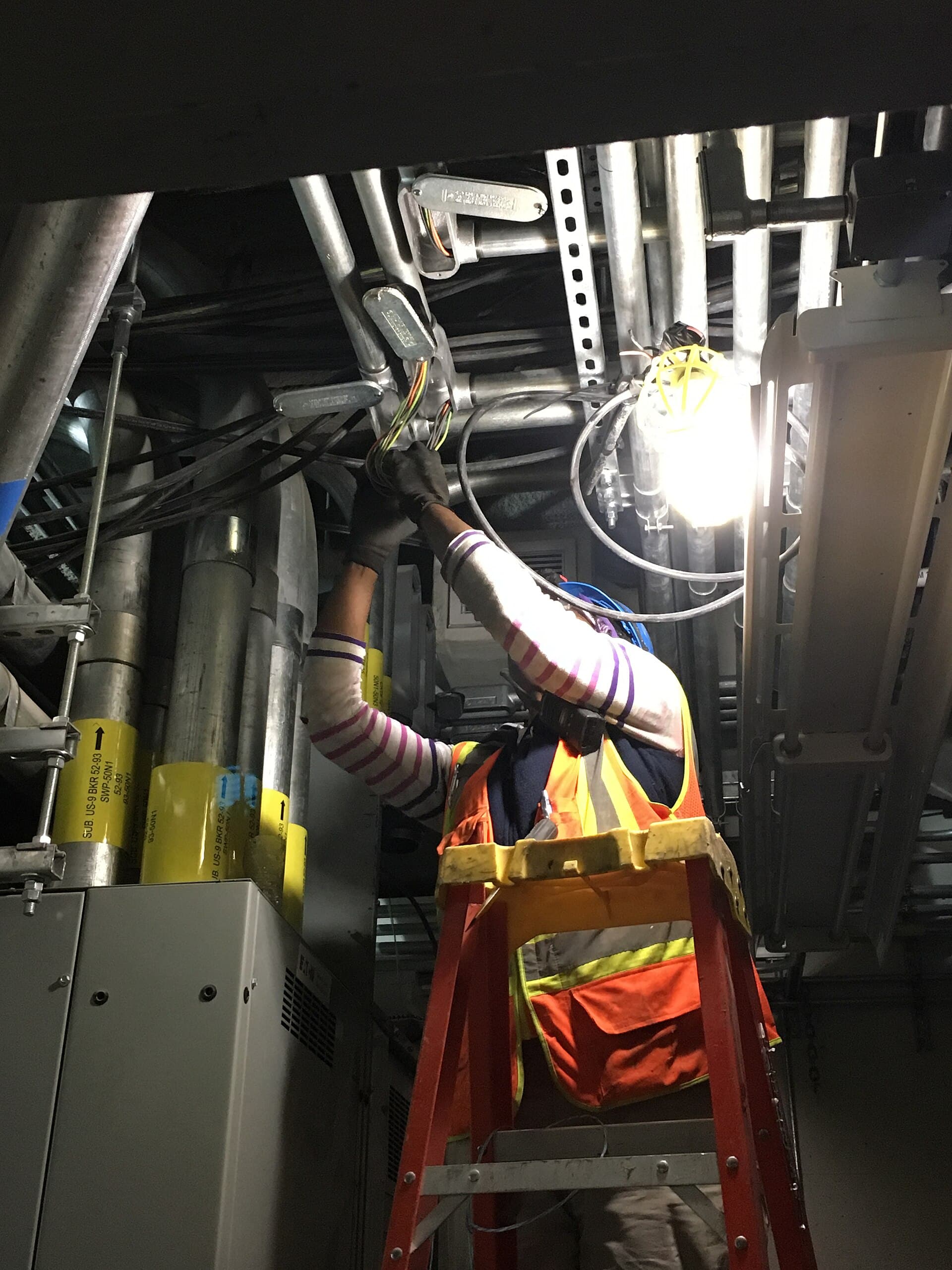 Electrician installing conduit